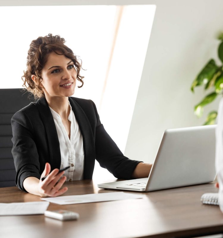 smiling-consultant-talking-to-a-client-on-a-business-meeting-portrait-.jpg